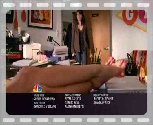 Jennifer Aniston feet on desk